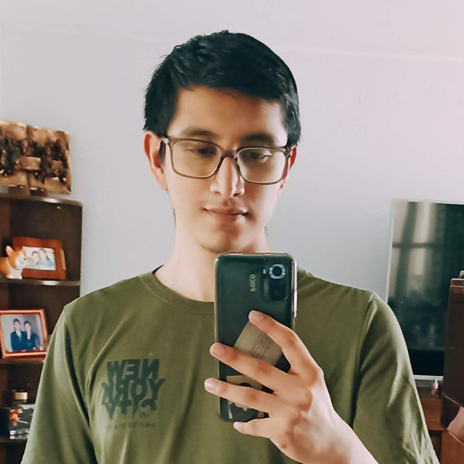 Me taking a photo on the mirror